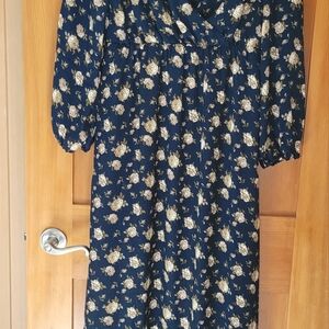 Beautiful flowy Maxi dress,never worn. Lined to above the knee Blue/gold flowers